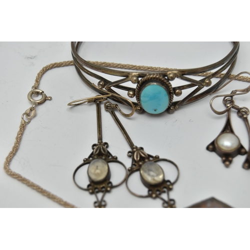 59 - A SMALL BAG OF JEWELLERY, to include a cuff bangle set with a blue stone cabochon, stamped 925, a pa... 