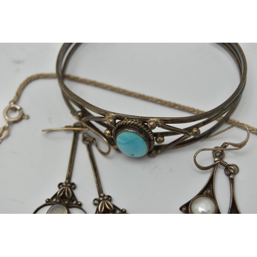 59 - A SMALL BAG OF JEWELLERY, to include a cuff bangle set with a blue stone cabochon, stamped 925, a pa... 