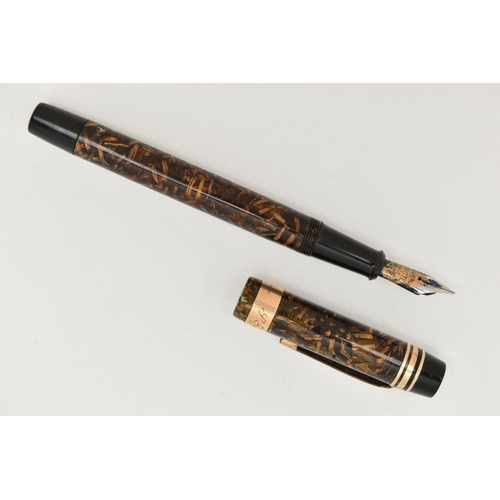 71 - AN 'ONOTO THE PEN' FOUNTAIN PEN, by De Larue & Co Ltd London, translucent brown barrel, fitted with ... 