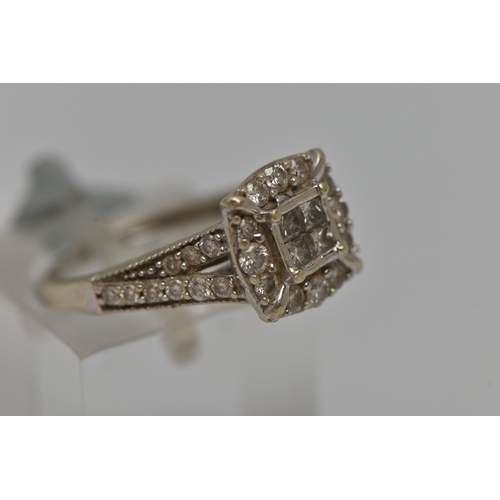 8 - A 9CT GOLD DIAMOND CLUSTER RING, square form ring set with four princess cut diamonds in an invisibl... 