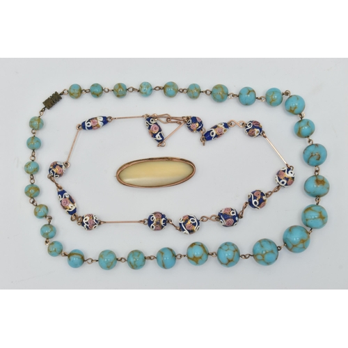 83 - AN EDWARDIAN 9CT YELLOW GOLD MOTHER OF PEARL BROOCH AND TWO BEAD NECKLACES, to include an oval shape... 