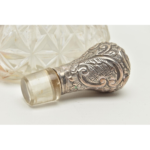 93 - A LATE VICTORIAN GLASS AND SILVER DECANTER, the hour glass bottle with silver collar and stopper emb... 