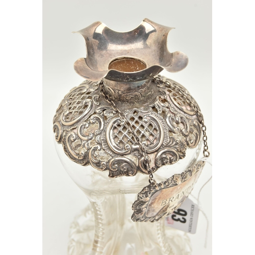 93 - A LATE VICTORIAN GLASS AND SILVER DECANTER, the hour glass bottle with silver collar and stopper emb... 