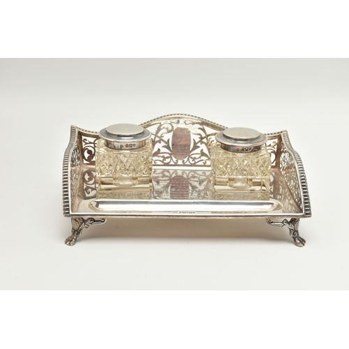 96 - AN EARLY 20TH CENTURY SILVER DESK TOP INK STAND SET, the rectangular ink stand with pierced floral a... 