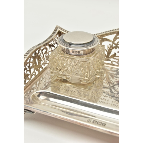 96 - AN EARLY 20TH CENTURY SILVER DESK TOP INK STAND SET, the rectangular ink stand with pierced floral a... 