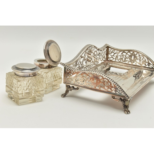 96 - AN EARLY 20TH CENTURY SILVER DESK TOP INK STAND SET, the rectangular ink stand with pierced floral a... 