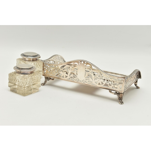 96 - AN EARLY 20TH CENTURY SILVER DESK TOP INK STAND SET, the rectangular ink stand with pierced floral a... 