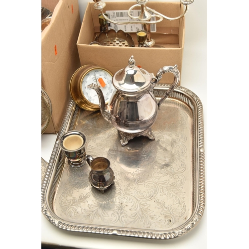 121 - TWO BOXES OF SILVER PLATED WARE, to include a large rectangular tray, an oval tray, placemats, cande... 