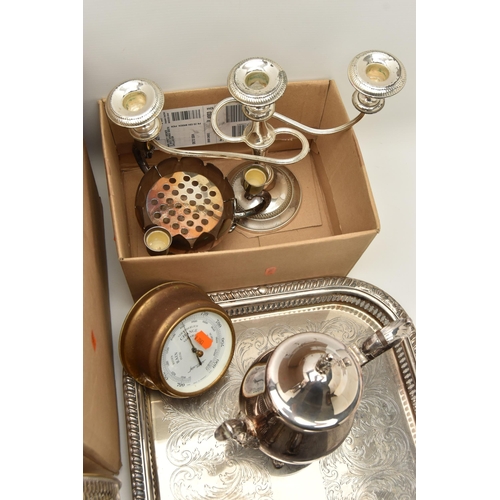 121 - TWO BOXES OF SILVER PLATED WARE, to include a large rectangular tray, an oval tray, placemats, cande... 