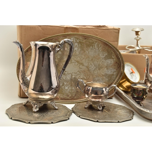 121 - TWO BOXES OF SILVER PLATED WARE, to include a large rectangular tray, an oval tray, placemats, cande... 