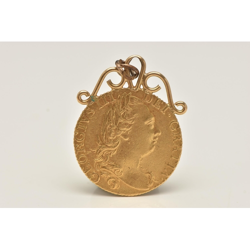 149 - A GEORGE III GOLD GUINEA 4th HEAD MOUNTED COIN, dated 1785, soldered with a yellow metal scrolling s... 