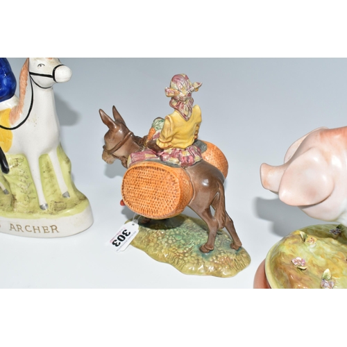 303 - A GROUP OF ANIMAL THEMED FIGURES, comprising a Beswick 'Susie Jamaica' 1347, a flatback Staffordshir... 