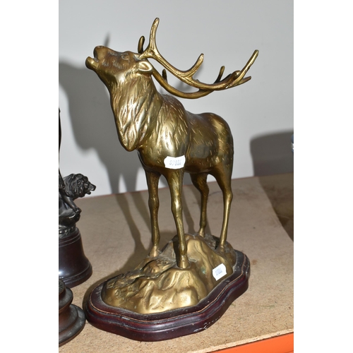 315 - FOUR METAL DECORATIVE FIGURES to include a brass Stag on raised outcrop height 29cm, a bronzed spelt... 