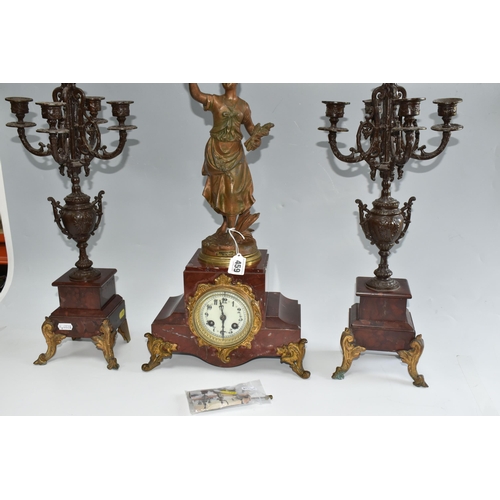 459 - A FRENCH ROUGE MARBLE CLOCK AND SIMILAR STYLE GARNTITURE, clock has a  gilt metal figure of 'Printem... 