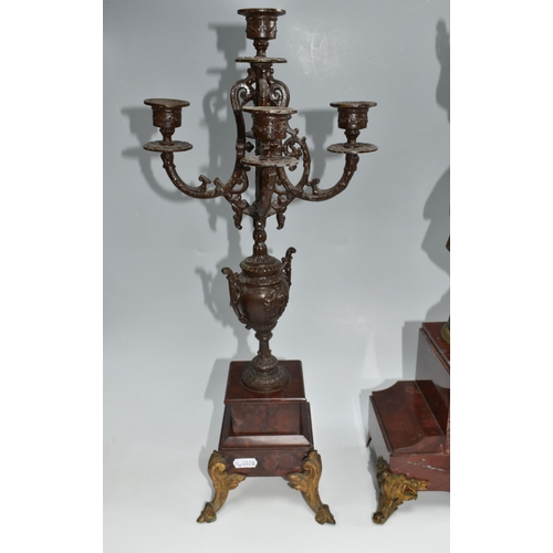 459 - A FRENCH ROUGE MARBLE CLOCK AND SIMILAR STYLE GARNTITURE, clock has a  gilt metal figure of 'Printem... 