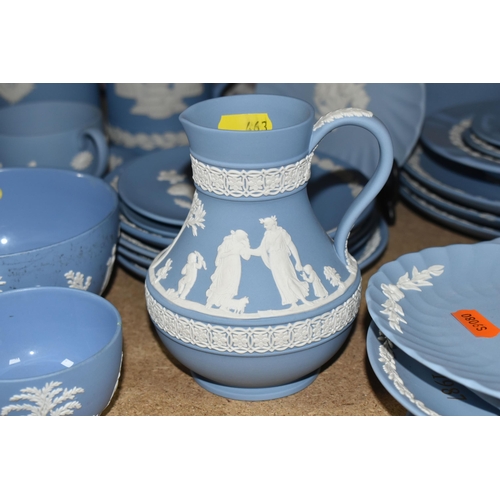 463 - A LARGE COLLECTION OF WEDGWOOD BLUE JASPERWARE, comprising a large sugar bowl (scratches and black m... 