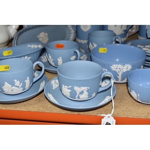 463 - A LARGE COLLECTION OF WEDGWOOD BLUE JASPERWARE, comprising a large sugar bowl (scratches and black m... 