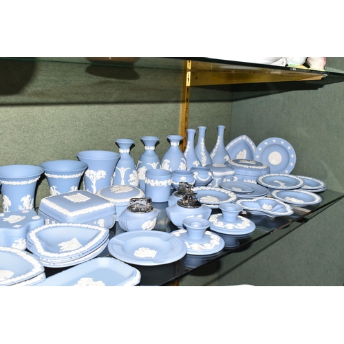 352 - A COLLECTION OF WEDGWOOD PALE BLUE JASPERWARE, over fifty pieces to include vases, tallest 13cm, tab... 