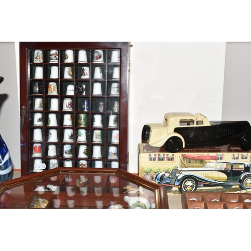 369 - A COLLECTION OF THIMBLES AND BOXED NOVELTY AVON FRAGRANCES, comprising Colt revolver - Blue Blazer a... 