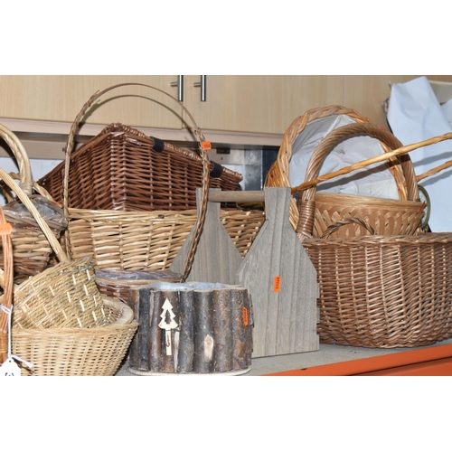 374 - A LARGE QUANTITY OF WICKER BASKETS, comprising wicker flower baskets, a small hamper, a shopping bas... 