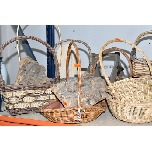 374 - A LARGE QUANTITY OF WICKER BASKETS, comprising wicker flower baskets, a small hamper, a shopping bas... 