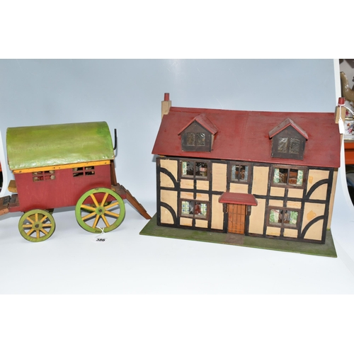 386 - A SCRATCHBUILT SMALL SCALE WOODEN DOLLS HOUSE, c.1950s, modelled as a half-timbered house, front ope... 