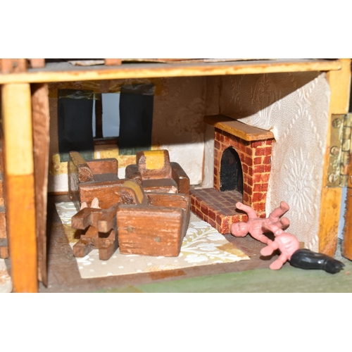 386 - A SCRATCHBUILT SMALL SCALE WOODEN DOLLS HOUSE, c.1950s, modelled as a half-timbered house, front ope... 