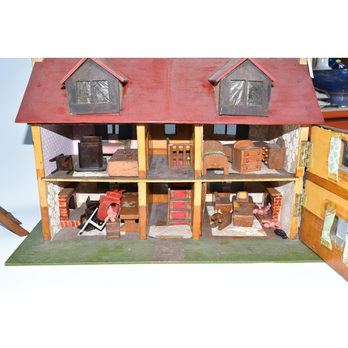 386 - A SCRATCHBUILT SMALL SCALE WOODEN DOLLS HOUSE, c.1950s, modelled as a half-timbered house, front ope... 