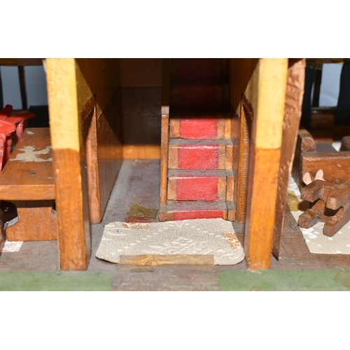 386 - A SCRATCHBUILT SMALL SCALE WOODEN DOLLS HOUSE, c.1950s, modelled as a half-timbered house, front ope... 