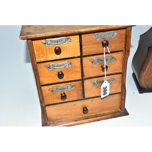 388 - A GROUP OF CLOCKS AND TREEN, comprising two wooden cased mantel clocks, a seven drawer spice rack, h... 