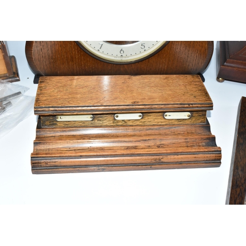 388 - A GROUP OF CLOCKS AND TREEN, comprising two wooden cased mantel clocks, a seven drawer spice rack, h... 