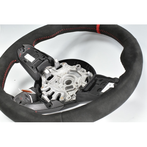 391 - A MINI COOPER STEERING WHEEL, no 159972-10, with a carbon graphite style cover (2) (Condition Report... 