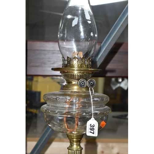 397 - AN OIL LAMP AND CEILING LIGHT FITTING, comprising a brass based oil lamp with glass reservoir, marke... 