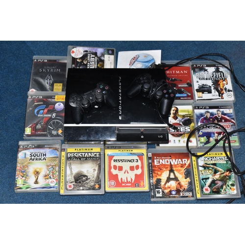 412 - A PLAYSTATION 3 CONSOLE AND GAMES, games include Resistance Fall Of Man, Resistance 3, Gran Turismo ... 