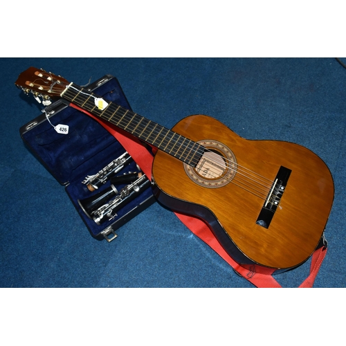 426 - A CASED CLARINET AND AN ACOUSTIC GUITAR, comprising cased clarinet by Blessing USA, serial number 14... 