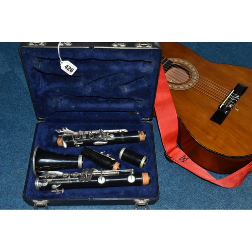 426 - A CASED CLARINET AND AN ACOUSTIC GUITAR, comprising cased clarinet by Blessing USA, serial number 14... 