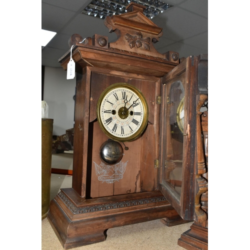 433 - THREE CLOCKS, comprising a large wooden mantel clock with pendulum and key, height 49cm, a smaller m... 