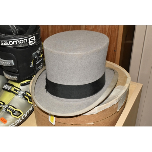 492 - A TOP HAT, SKI BOOTS AND BABIES' GOWNS, comprising a boxed grey top hat with black band, stamped to ... 