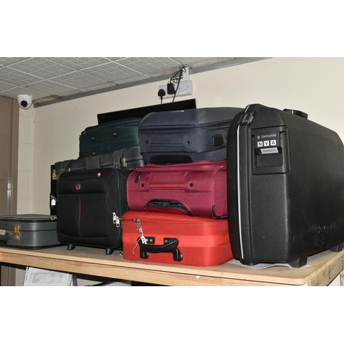 513 - ELEVEN MIXED SUITCASES to include a 43cm x 34cm x 23cm Swiss soft carry on case, a 67cm x 57cm x 24c... 