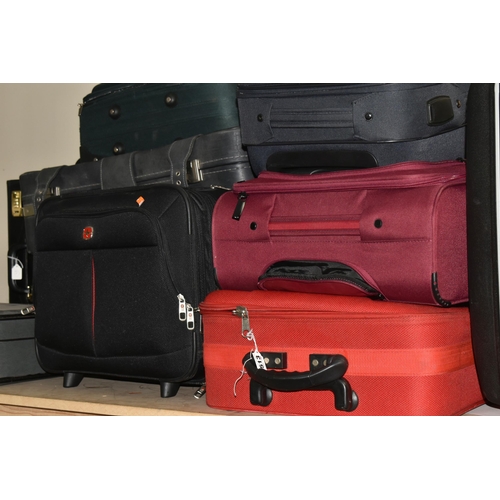 513 - ELEVEN MIXED SUITCASES to include a 43cm x 34cm x 23cm Swiss soft carry on case, a 67cm x 57cm x 24c... 