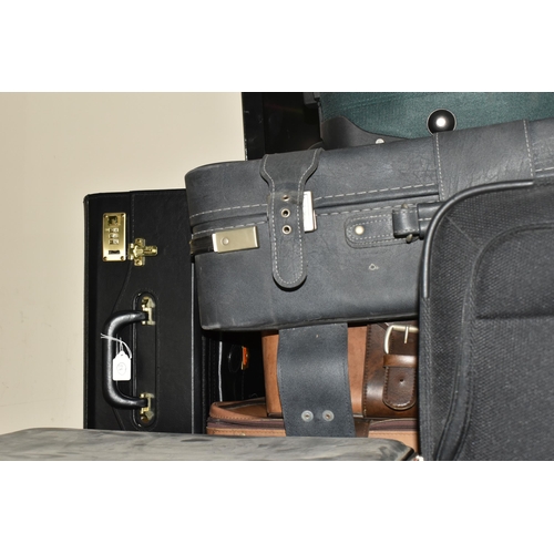 513 - ELEVEN MIXED SUITCASES to include a 43cm x 34cm x 23cm Swiss soft carry on case, a 67cm x 57cm x 24c... 