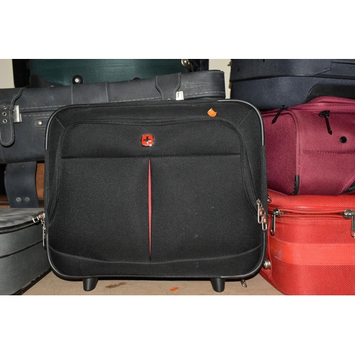 513 - ELEVEN MIXED SUITCASES to include a 43cm x 34cm x 23cm Swiss soft carry on case, a 67cm x 57cm x 24c... 