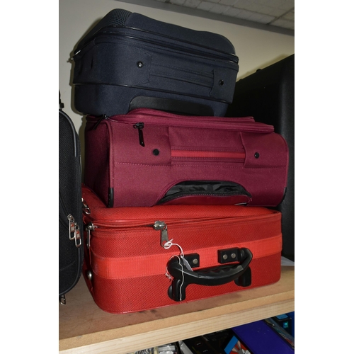 513 - ELEVEN MIXED SUITCASES to include a 43cm x 34cm x 23cm Swiss soft carry on case, a 67cm x 57cm x 24c... 