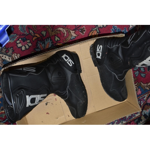 516 - TWO BOXES OF MOTOR BIKE CLOTHING to include a pair of size 34 J & S leather bikers trousers, a pair ... 