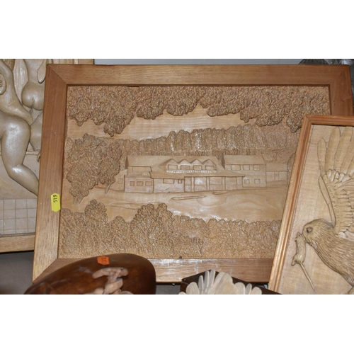 519 - A COLLECTION OF TREEN, comprising six carved wood wall plaques carved signature to the back 'SamL' (... 