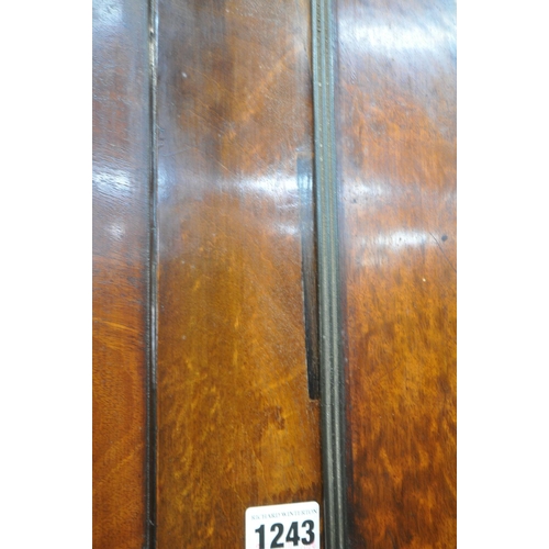 1175 - A GEORGIAN MAHOGANY LINENPRESS, the double doors enclosing four linen slides, atop a base fitted wit... 