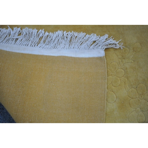 1179 - A MUSTARD YELLOW CHINESE RUG, 346cm x 247cm (condition report: discoloured and dirty)