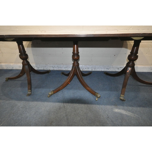 1198 - A 20TH CENTURY MAHOGANY TRIPLE PEDESTAL OVAL DINING TABLE, length 276cm x closed length 184cm x dept... 