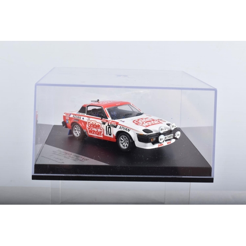 22 - FOUR BOXED TRIUMPH TR7 AND TR8 SPORTS CAR MODELS, all 1/43 white metal kits that have been construct... 