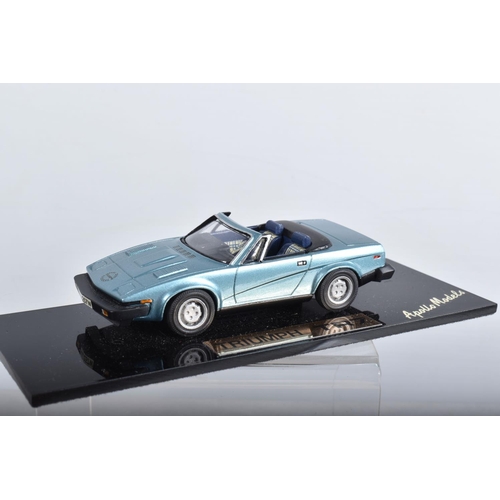 22 - FOUR BOXED TRIUMPH TR7 AND TR8 SPORTS CAR MODELS, all 1/43 white metal kits that have been construct... 